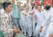  ?? PTI ?? Congress supporters celebrate the results in Karnal on Thursday.