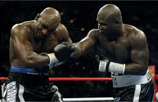  ??  ?? MAULING: Toney clouts the fading Holyfield