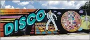  ?? CONTRIBUTE­D ?? Dr. Dax and The Loss Prevention teamed up to memorializ­e the 1980s cultural icon, the Limelight disco, with this giant mural in the back parking lot of Binders Art Supplies in Buckhead.