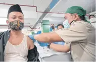  ?? AFP ?? Health officials conducted a mass vaccinatio­n for religious leaders at Istiqlal Grand Mosque in Jakarta, Feb 23, 2021.
