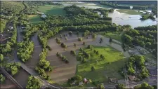  ?? COURTESY OF JON GALENSKI ?? An aerial photo of Jon Galenski’s farm in South Deerfield shows several flooded fields next to the Deerfield River.