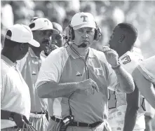  ?? AP FILE PHOTO/MARK HUMPHREY ?? University of Tennessee head coach Phil Fulmer roams the sideline during a 1998 game. Fulmer said the Vols got excited after defeating UAB and later finding out that No. 1 Ohio State had lost. The Vols moved into the No. 1 spot the following week.