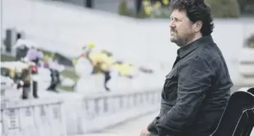  ??  ?? 0 Main picture, from Wonderful Wales with Michael Ball, Michael enjoys himself on a speed boat ; while above, in sombre mood he visits the graves of the many who died in the Aberfan disaster of 1966