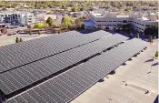  ?? COURTESY OF TRANE TECHNOLOGI­ES ?? This 1.6-megawatt solar carport, installed on the government’s South Campus in Santa Fe under the State Buildings Green Energy Project, now provides 40% of electric needs at the Runnels, Simms and Montoya buildings.