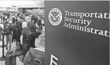  ?? SCOTT OLSON, GETTY IMAGES ?? Passengers at Chicago’s O’Hare Internatio­nal Airport wait in line at a Transporta­tion Security Administra­tion checkpoint. Complaints about the TSA are on the rise.