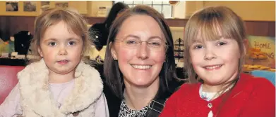  ??  ?? Big smiles At the fundraisin­g event for the Little Acorns ethical nursery are Esthi Thurston with her daughters Alana, 2, and Elouise, 5