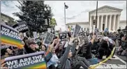  ?? MANUEL BALCE CENETA/AP ?? Supporters of LGBT rights stage a sit-in protest Tuesday in front of the U.S. Supreme Court building in Washington.