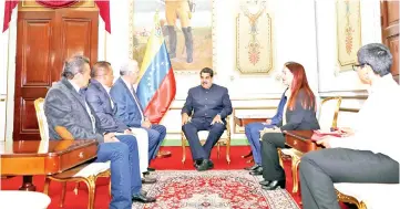  ??  ?? Maduro meets with elected governor of Merida state Ramon Guevara (left), elected governor of Nueva Esparta state Alfredo Diaz (second left) and elected governor of Anzoategui state Antonio Barreto (third left) at Miraflores Palace in Caracas,Venezuela. — Reuters photo