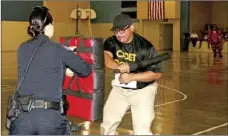  ??  ?? Eric Lopez (right), Calipatria High School senior, shows off defensive skills during the annual IVROP Law Enforcemen­t Skills Competitio­n in Brawley on Thursday. WILLIAM ROLLER PHOTO