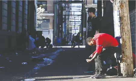  ?? REUTERS/JESSE WINTER ?? A man injects street drugs in a Downtown Eastside alley. B.C. has had more than 5,000 deaths from illicit drug overdoses since declaring a public health emergency in 2016 and a new study is pointing the finger directly at the rise of synthetic opioids and stimulants.