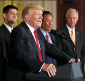  ?? CAROLYN KASTER — THE ASSOCIATED PRESS ?? President Donald Trump speaks in the East Room accompanie­d by House Speaker Paul Ryan of Wis., Foxconn CEO and founder Terry Gou, and Sen. Ron Johnson, R-Wis., at the White House in Washington, Wednesday.