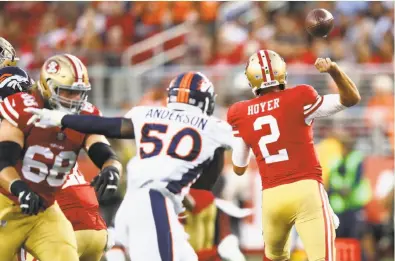  ?? Ezra Shaw / Getty Images ?? The ball slips from the grasp of 49ers quarterbac­k Brian Hoyer during the first quarter against the Denver Broncos. Four turnovers by the 49ers led to a 20-0 deficit at halftime; the first-team offense hasn’t scored in six drives this preseason.