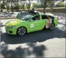  ?? RYAN NAKASHIMA - THE ASSOCIATED PRESS ?? In this Aug. 29 photo, a Lincoln MKZ outfitted with AutoX’s self-driving sensors sits in the parking lot of the company’s headquarte­rs in San Jose, Calif. The company is partnering with grocery delivery startup GrubMarket in a pilot test to deliver groceries to shoppers near the company’s headquarte­rs.