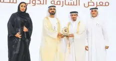  ??  ?? WAM Ahmad Al Ameri, chairman of the Sharjah Book Authority, ■ receives the award.