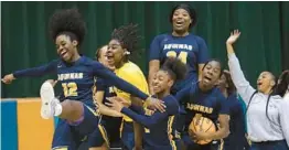  ?? JOHN MCCALL/SOUTH FLORIDA SUN SENTINEL ?? St. Thomas Aquinas players celebrate after beating Blanche Ely during the 6A girls basketball regional final on Friday in Pompano Beach.