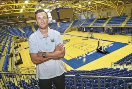 ?? CATHERINE AVALONE/HEARST CONNECTICU­T MEDIA ?? Quinnipiac’s new men’s basketball coach Baker Dunleavy at the TD Bank Sports Center in Hamden.