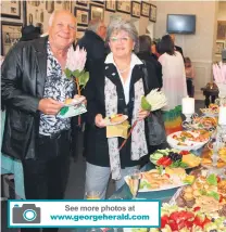  ?? ?? See more photos at www.georgehera­ld.com
Nico Köhne and his wife Norma at the feast.