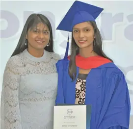  ?? Photo: Fiji National University ?? Shimran Kishore (right) with her friend Christila Chetty at FNU’s Tamavua Campus.