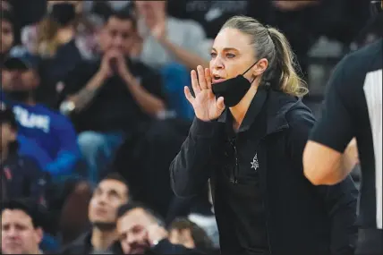  ?? ERIC GAY / AP FILE (2021) ?? Becky Hammon, the new coach of the Las Vegas Aces, is installing her “pace and space” system with the team — pushing the pace of the game and spacing the f loor with shooting. The Aces, who opened the season Friday at Phoenix and have their home opener today, are going to light up the scoreboard. The question is, can Hammon get them to play the kind of defense that will deliver the franchise’s first WNBA title?