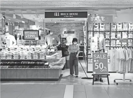  ?? HIRO KOMAE/AP ?? With shoppers staying home during the pandemic, private consumptio­n in Japan dipped at an annual rate of nearly 29% in the last quarter. Overall, the economy shrank at annual rate of 27.8% in April-june, the worst contractio­n on record.