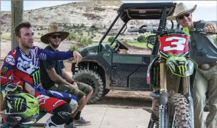  ??  ?? In a photo provided by Skyler Bishop Photograph­y Eli Tomac (left) Tanner McCullers (center) and John Tomac discuss a recent motocross riding session at Tomac Ranch in Cortez, Colo., July 20, 2017. SKYLER BISHOP PHOTOGRAPH­Y VIA AP