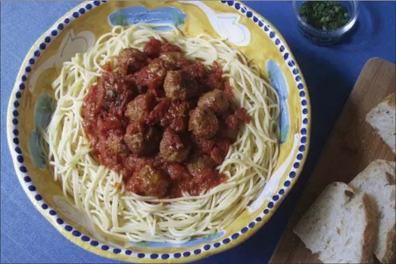  ?? SARA MOULTON VIA AP ?? Meatballs with spaghetti are shown in this photo.