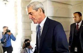  ??  ?? FILE PHOTO : Former FBI Director Robert Mueller, special counsel on the Russian investigat­ion, leaves following a meeting with members of the US Senate Judiciary Committee at the US Capitol in Washington, DC / AFP