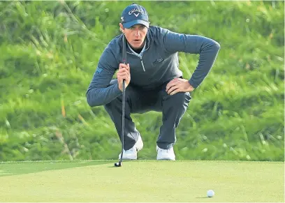  ?? Getty. ?? Nicolas Colsaerts lines up a putt on the 14th green on his way to a share of the halfway lead.