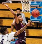  ?? Doug McSchooler / Associated Press ?? Forward John Walker III, right, had 19 points and nine rebounds in Texas Southern’s comeback win.