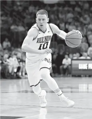  ?? AP Photo/Laurence Kesterson, File ?? ■ Villanova guard Donte DiVincenzo (10) dribbles during an NCAA college basketball game against Butler on Feb. 10 in Philadelph­ia. DiVincenzo was the surprise star of the NCAA championsh­ip game for Villanova, then became a surprise NBA draft entrant.