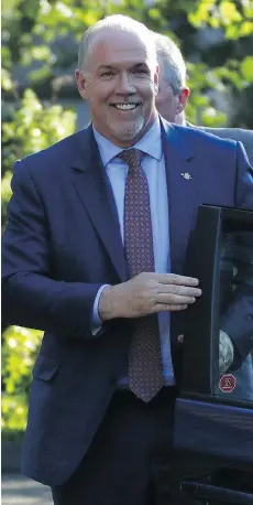  ?? CHAD HIPOLITO/THE CANADIAN PRESS ?? NDP leader John Horgan arrives at Government House to speak with Lt.Gov. Judith Guichon. His instincts on the drive to the meeting led him to believe Guichon was in his corner.
