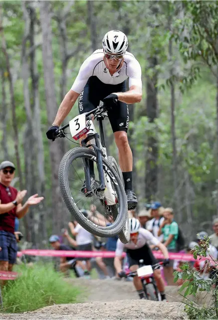  ?? PHIL WALTER/GETTY IMAGES ?? Sam Gaze flying high en route to winning the men’s mountainbi­ke race on the Gold Coast yesterday .