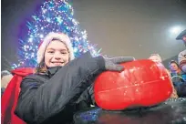  ??  ?? Fireworks at Perth’s switch-on last year, left, and Millie-rose Garrick Orr turns on Lochee’s lights.