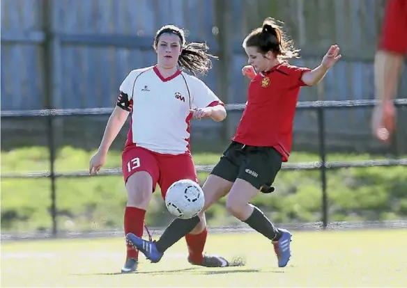  ?? PHOTO: PHOTOTEK ?? West Auckland’s Esther Bushell gets a foot to the ball against Ellerslie in the Women’s Conference League.