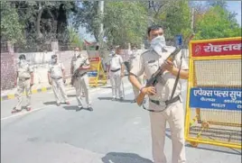  ?? MANOJ DHAKA/HT ?? Police personnel on duty near Ambedkar Chowk in Rohtak on Friday.