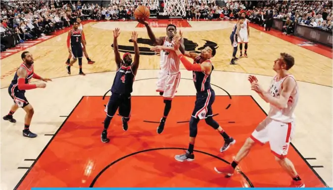  ?? —AFP ?? TORONTO: Pascal Siakam #43 of the Toronto Raptors goes to the basket against the Washington Wizards in Game Two of Round One of the 2018 NBA Playoffs on Tuesday at the Air Canada Centre in Toronto, Ontario, Canada.