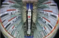  ?? WANG JIANGBO / FOR CHINA DAILY ?? The Shenzhou XIII spacecraft and the Long March 2F carrier rocket are moved from a testing facility to a launch tower at the Jiuquan Satellite Launch Center on Thursday.