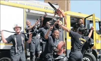  ?? PICTURES: NQOBILE MBONAMBI ?? FIREY FOLK: Heroes of last weekend’s warehouse fire in south Durban, from left, Justin Bateman,Thembela Hlongwane, Segran Moodley, Shalako Comeroden, holding a chainsaw, and Mduduzi Ngubeni, in the driver’s seat of a fire engine. And in front, Grace...