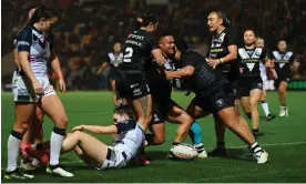  ?? ?? New Zealand’s Mele Hufanga (centre) is congratula­ted after scoring her side’s first try which began a hugely impressive individual display. Photograph: Gareth Copley/Getty