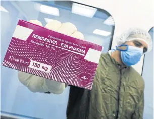  ?? REUTERS ?? A lab technician shows the Covid-19 treatment drug ‘remdesivir’ at Eva Pharma Facility in Cairo, Egypt.