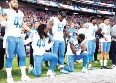  ?? AFP ?? Jalen Reeves-Maybin (left) of the Detroit Lions and teammate Steve Longa take a knee during the US national anthem before the game against the Minnesota Vikings on Sunday in Minneapoli­s.
