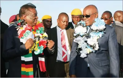  ?? — (Picture by Tawanda Mudimu) ?? President Mnangagwa welcomes his Botswana counterpar­t President Mokgweetsi Masisi on arrival at Robert Gabriel Mugabe Internatio­nal Airport in Harare yesterday.