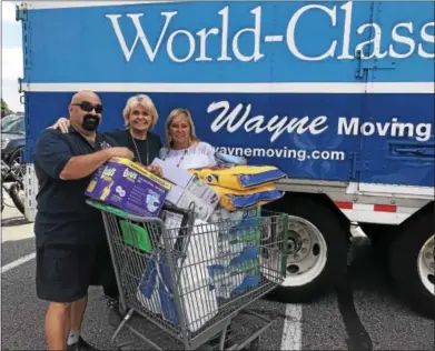  ?? SUBMITTED PHOTO ?? Chester County Sheriff Bunny Welsh helps load supplies targeted for the Houston relief effort at the Giant supermarke­t in the Dilworthto­wn Crossing Shopping Center on Thursday.