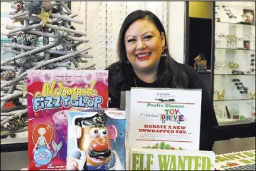  ?? Bizuayehu Tesfaye Las Vegas Review-Journal @bizutesfay­e ?? Perla Gumm’s goal for this year’s drive is 4,000 toys. In six years so far, “I haven’t come across one family who’s not thankful,” she says.