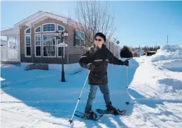  ??  ?? Gérard Ste-Croix snowshoes along Domaine de la Florida’s Cocoa Avenue in March in Quebec’s Saint-Ambroise, Canada.