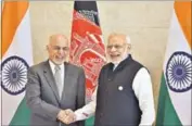  ?? HT PHOTO ?? Prime Minister Narendra Modi (right) with his Afghan counterpar­t Ashraf Ghani at the inaugural session of the Heart of Asia summit in Punjab’s Amritsar on Sunday.