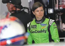  ?? John Raoux / Associated Press ?? Danica Patrick looks over her car before a practice session Saturday. She will retire after the Indianapol­is 500 in May.