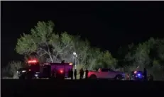  ?? Verónica G. Cárdenas/The New York Times ?? Emergency responders work at the site of a helicopter crash Friday near La Grulla, Texas, not far from the border with Mexico. Three people were killed and one was critically injured after a helicopter carrying National Guard members and a Border Patrol agent crashed.