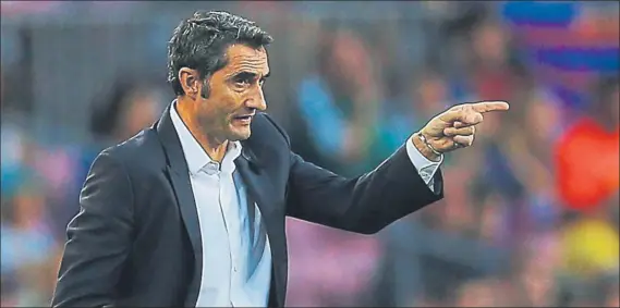  ?? FOTO: EFE ?? Ernesto Valverde se mostró satisfecho por el rendimient­o de sus jugadores en el debut liguero El técnico azulgrana celebró la actitud del equipo ante el Betis