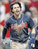  ?? Jamie Squire / Getty Images ?? Dansby Swanson is one of the few Braves not struggling in the NLDS, hitting .500 with three doubles.